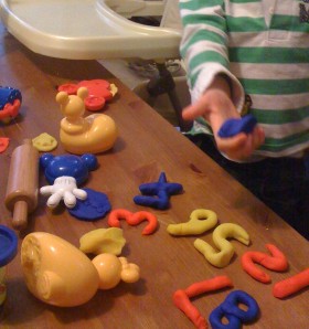 Learning is taking place: even exciting new moulds could not measure up against the joy of just getting Mummy to make more numbers out of Play-doh